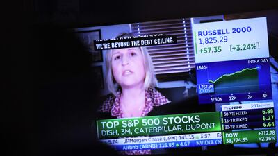 Traders work at the New York Stock Exchange. A record $8.5 billion flowed into tech stocks in the latest week. AFP