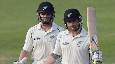 New Zealand cricket captain Brendon McCullum (R) celebrates after scoring a century (100 runs) as teammate Kane Williamson looks on during the second day of the third and final Test match between New Zealand and Pakistan at the Sharjah cricket stadium in Sharjah on November 28, 2014. New Zealand were 164-1 at tea on the second day of the third and final Test against Pakistan. McCullum was on a quickfire 100 and with him Kane Williamson on 44 as New Zealand now trail Pakistan's first innings total of 351 by 187 runs. Aamir Qureshi / AFP