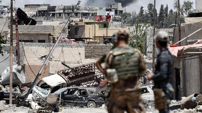 Smoke billows from western Mosul’s Al Shifa district on June 15, 2017, during an ongoing offensive by Iraqi forces to retake the city from ISIL. Mohamed El Shahed / AFP