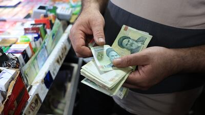 A redenomination of Iran's currency would mean 10,000 rials would become one. EPA
