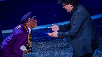 South Korean film director Bong Joon-ho accepts the award for Best Director for 'Parasite' from US director Spike Lee at the 92nd Academy Awards on Sunday, February 9. AFP