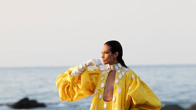 Stephane Rolland enjoyed mixing surfaces for his haute couture, as evidenced in this voluminous satin dress, encrusted with bakelite and crystal cabochon-cut pieces.