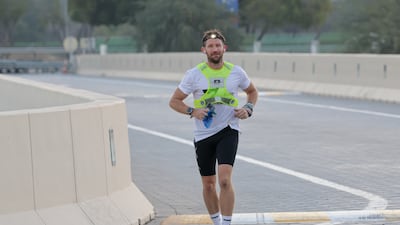 Runner Harry Amos passes the Adnoc station at Al Jurf