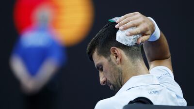 Novak Djokovic puts ice on his head in Melbourne. EPA