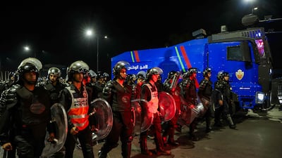 Policemen guard a street in Sale. Two people were killed when officers opened fire on a group of people attempting to storm a police station. AFP