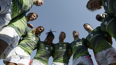 South Africa's players huddle after beating Uganda 46-0 on Friday. Martin Dokoupil / AP Photo / December 2, 2016