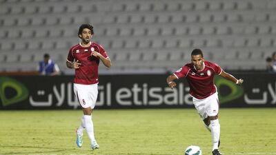 Al Wahda’s Hamdan Al Kamali, left, spent six months on loan at French club Lyon on 2012. Razan Alzayani / The National