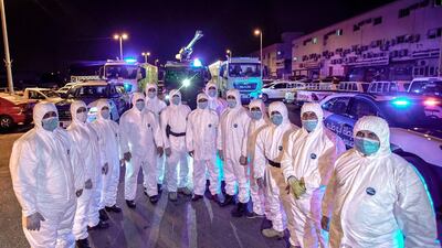 Abu Dhabi Civil Defence and Police sterilisation drive in Mussafah. Abu Dhabi First Responder teams used a fleet of futuristic-looking equipment, which was originally rolled out to tackle fires, has now been redeployed as virus-fighting tech in the National Disinfection Programme. Victor Besa/The National