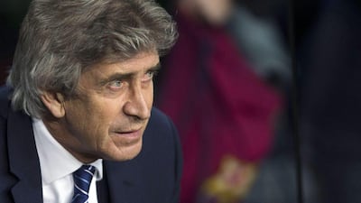 Manchester City manager Manuel Pellegrini observes his side during their Champions League loss to Barcelona at the Camp Nou on Wednesday. Alejandro Garcia / EPA