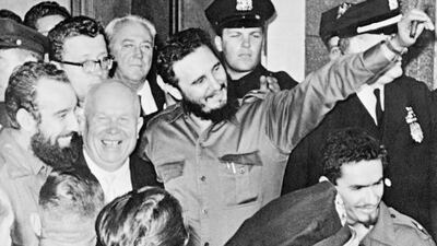 On his first visit to the United Nations after coming to power, Fidel Castro stands with Soviet premier Nikita Khrushchev, centre left, outside the Hotel Theresa in Harlem, New York, on September 20, 1960. AP Photo