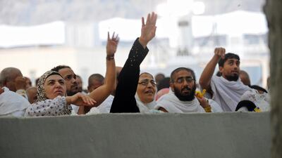 Muslim pilgrims throw pebbles at pillars during the "Jamarat" ritual, the stoning of Satan, in Mina near the holy city of Mecca. Fayez Nureldine / AFP