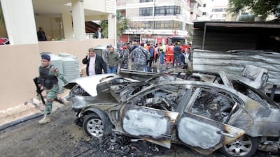 Lebanese soldiers inspect a damaged car in the southern city of Sidon on January 14, 2018. Ali Hachicho / Reuters