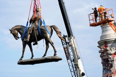 Last month, crews removed one of the country's largest remaining monuments to the Confederacy, a towering statue of Confederate General Robert E. Lee in Richmond, Virginia. AP