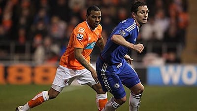 Chelsea's Frank lampard, right, shields the ball from Blackpool's Jason Puncheon during his sides' 3-1 at Bloomfield Road.