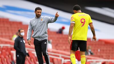 Watford caretaker manager Hayden Mullins, left, on the touchline with Troy Deeney. PA