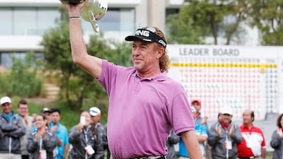 Miguel Angel Jimenez of Spain celebrates with the trophy after winning the Open de Espana held at PGA Catalunya Resort on May 18, 2014 in Girona, Spain. Dean Mouhtaropoulos / Getty Images