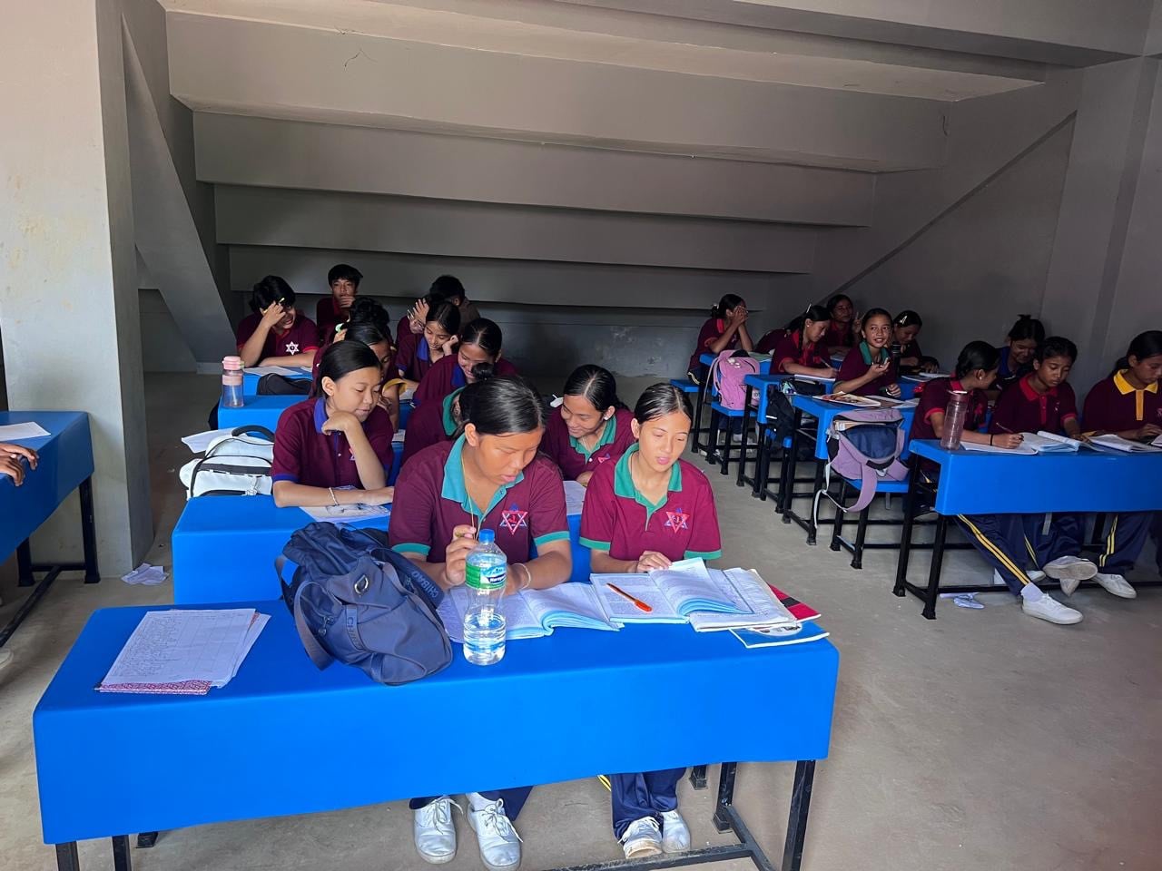 Classes are being held in stairwells of a sports academy until a new facility is built. Photo: Rajendra Dawadi
