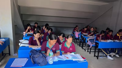 Classes are being held in stairwells of a sports academy until a new facility is built. Photo: Rajendra Dawadi