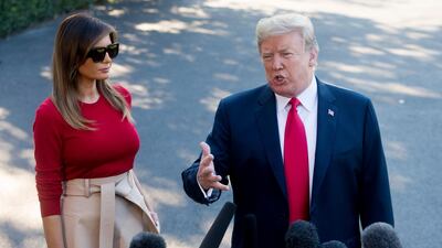 US President Donald Trump speaks to the media, alongside First Lady Melania Trump, before departing for Europe from the South Lawn of White House, on July 10, 2018. EPA