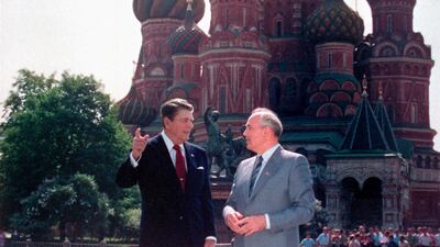 Reagan and Gorbachev talk during a walk in Red Square in Moscow, the former Soviet Union, on May 31, 1988. AP