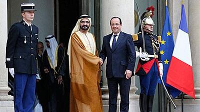 Sheikh Mohammed bin Rashid, Vice President and Ruler of Dubai, shakes hands with the French president Francois Hollande at the Elysee Palace in Paris yesterday. Sheikh Mohammed’s visit follows his appearance at the presentation of Dubai’s bid for Expo 2020 on Wednesday. Yoan Valat / EPA
