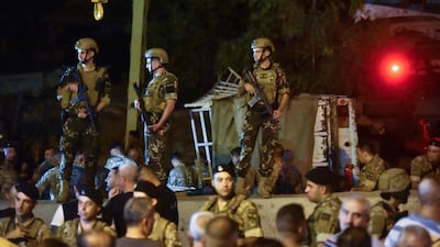 Lebanese army soldiers and onlookers gather in Kahaleh. AFP