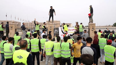 Protesters chant slogans in front of Basra's provincial council building during a demonstration demanding better public services and jobs. AP