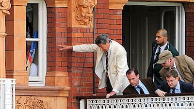 MCC members inspect a broken window after Matt Prior returned to the dressing room.