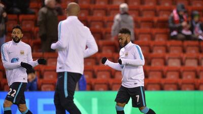 Manchester City's English midfielder Raheem Sterling (R) warms up with teammates ahead of the English Premier League football match between Liverpool and Manchester City at Anfield in Liverpool, north west England on March 2, 2016. - RESTRICTED TO EDITORIAL USE. No use with unauthorized audio, video, data, fixture lists, club/league logos or 'live' services. Online in-match use limited to 75 images, no video emulation. No use in betting, games or single club/league/player publications. / AFP / Paul ELLIS / RESTRICTED TO EDITORIAL USE. No use with unauthorized audio, video, data, fixture lists, club/league logos or 'live' services. Online in-match use limited to 75 images, no video emulation. No use in betting, games or single club/league/player publications.
