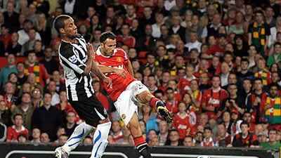 Ryan Giggs, right, scores Manchester United's third with a well-timed volley.