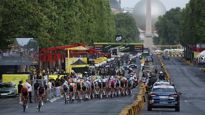 Riders go past the Luxor Obelisk during Stage 21. Reuters