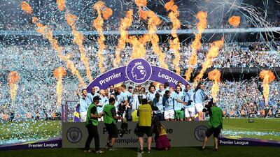 Vincent Kompany of Mancheter City lifts The Premier League Trophy after the Premier League match between Manchester City and Huddersfield Town at Etihad Stadium in Manchester, England, on May 6, 2018. Shaun Botterill / Getty Images