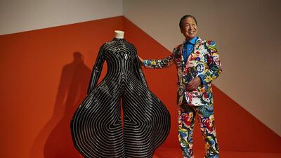 Kansai Yamamoto with a suit he created for David Bowie. Courtesy Kansai Yamamoto