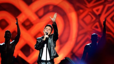 Ireland's Ryan Dolan, centre, performs the song 'Only love survives' . Jessica Gow / EPA