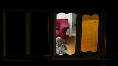 A woman prays at home during Ramadan in Cairo, Egypt. EPA