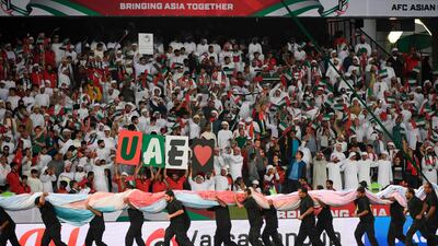UAE fans cheer for their team prior to the 2019 AFC Asian Cup football game between United Arab Emirates and Bahrain at the Zayed Sports City. AFP