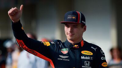 Red Bull'sMax Verstappen waves after taking pole position for the Brazilian Grand Prix. AFP