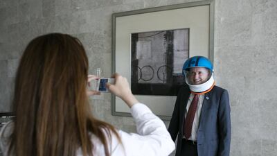 Professor Tim McGloughlin, Chair Biomedical Engineering, Khalifa University, poses with a space helmet. Silvia Razgova for The National