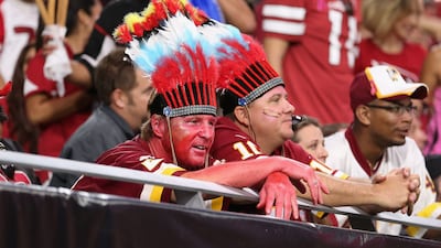 Fans watch the second half of the NFL game against the Arizona Cardinals in Glendale, Arizona. The NFL's Washington Football Team, which dropped the controversial nickname "Redskins" last year, said it will ban spectators from wearing Native American ceremonial head gear or face paint at home games. Getty / AFP