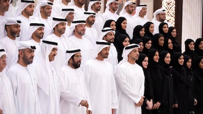 Hamad Abdul Rahman Al Madfa, Secretary General of the Supreme Council of the Union Affairs in the Ministry of Presidential Affairs (first row left), Ahmed Mohamed Al Humairi, the Secretary-General of the Ministry of Presidential Affairs (first row second left), Ahmed Juma Al Zaabi, UAE Deputy Minister of Presidential Affairs (first row third left), Sheikh Tahnoon bin Mohamed , Ruler's Representative in Al Ain Region (first row fourth left), Sheikh Mohamed bin Zayed, Crown Prince of Abu Dhabi and Deputy Supreme Commander of the UAE Armed Forces (first row fifth left) and Sheikh Mansour bin Zayed, UAE Deputy Prime Minister and Minister of Presidential Affairs (first row sixth left), stand for a photograph with members of Ministry of Presidential Affairs, during an iftar reception at Abu Dhabi's Al Bateen Palace.