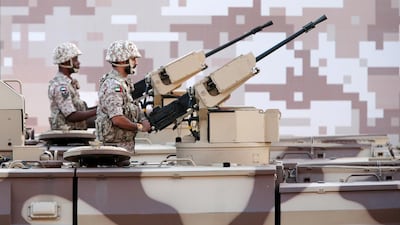 UAE soldiers on military vehicles during the parade.
