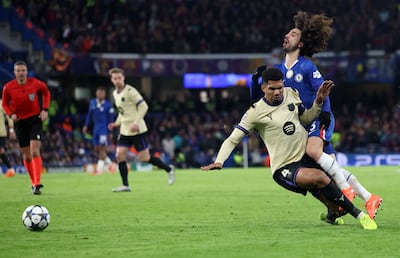 Barcelona's Ronald Araujo puts in a robust challenge on Chelsea's Marc Cucurella before being shown a second yellow card. EPA
