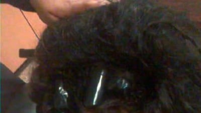 Wraps of cocaine were concealed in this woman’s hair when she flew into Dubai. Courtesy Dubai Police