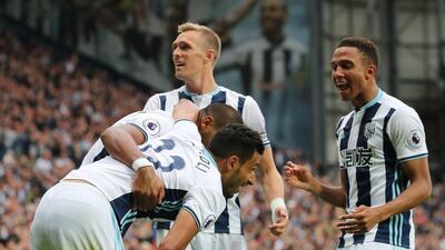 West Brom’s Nacer Chadli celebrates scoring their fourth goal with teammates. Eddie Keogh / Reuters