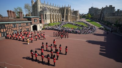 The Band of the Coldstream Guards play Happy Birthday to mark the 96th birthday of Queen Elizabeth II, during the Changing the Guard at Windsor Castle. PA