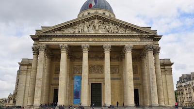 The Pantheon is topped by a giant dome, fronted by towering columns and decorated with marble