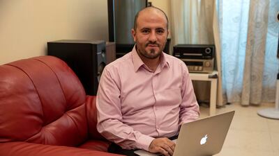 Apartment owner Mohammed Mazin, an IT professional by trade, in his apartment where he spends more than Dh1,000 a month for a basic 3G package. Antonie Robertson / The National