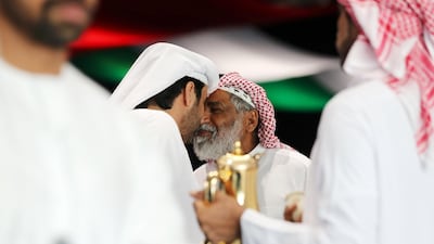 Men arrive at Adnec to cast their ballots. Chris Whiteoak / The National