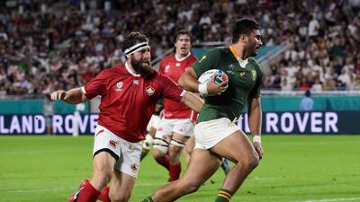 South Africa's Damian de Allende runs in to score their first try. Reuters