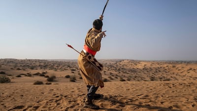 Muhammad Ahmed launches an arrow at a 45-degree angle in the long-distance round of the competition